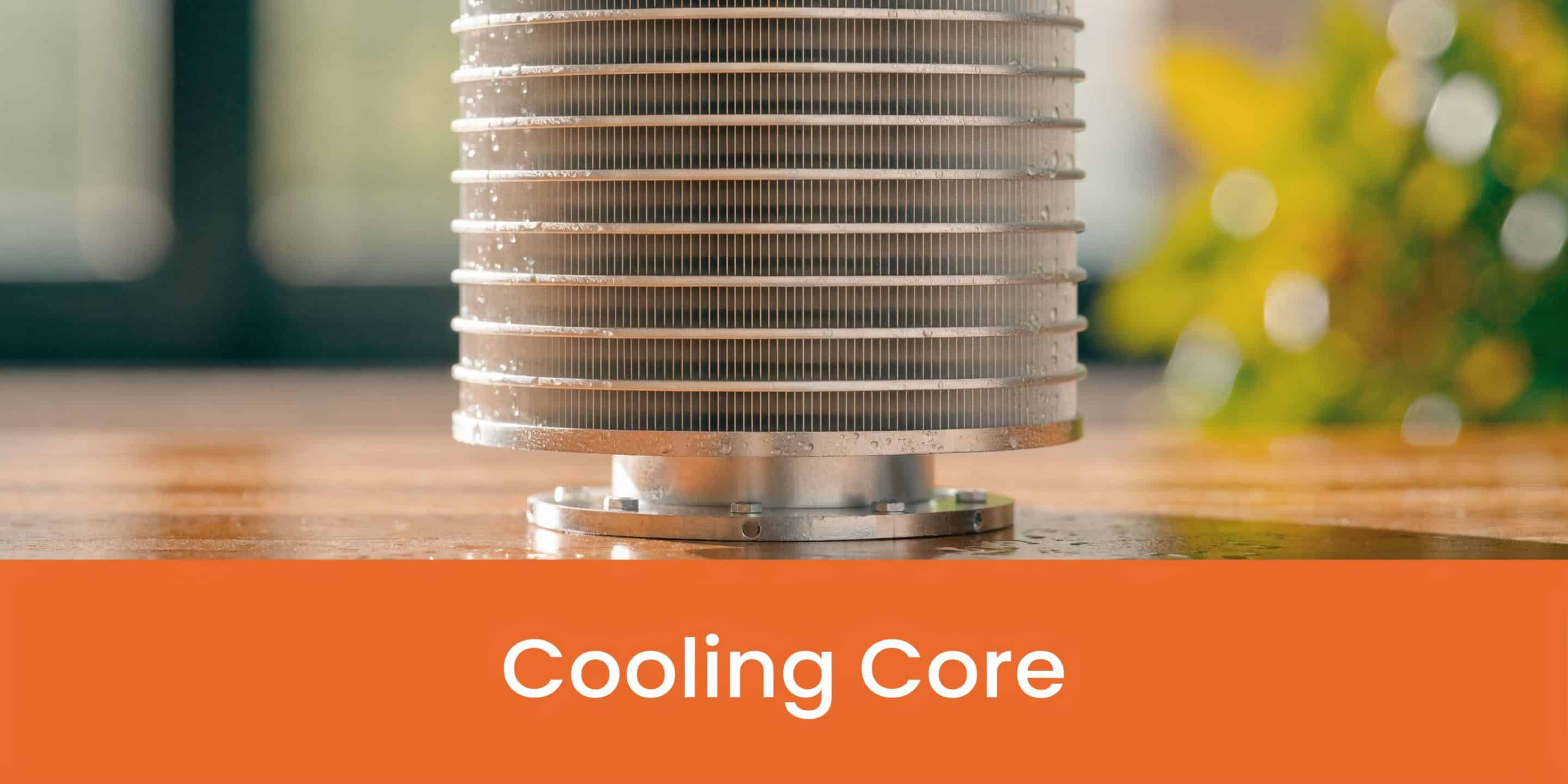 A close-up view of a metal industrial cooling core unit sitting on a wooden surface.